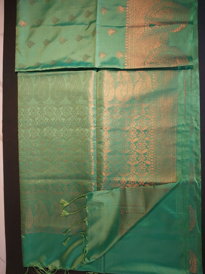 Dark Green with self border soft semi silk saree.